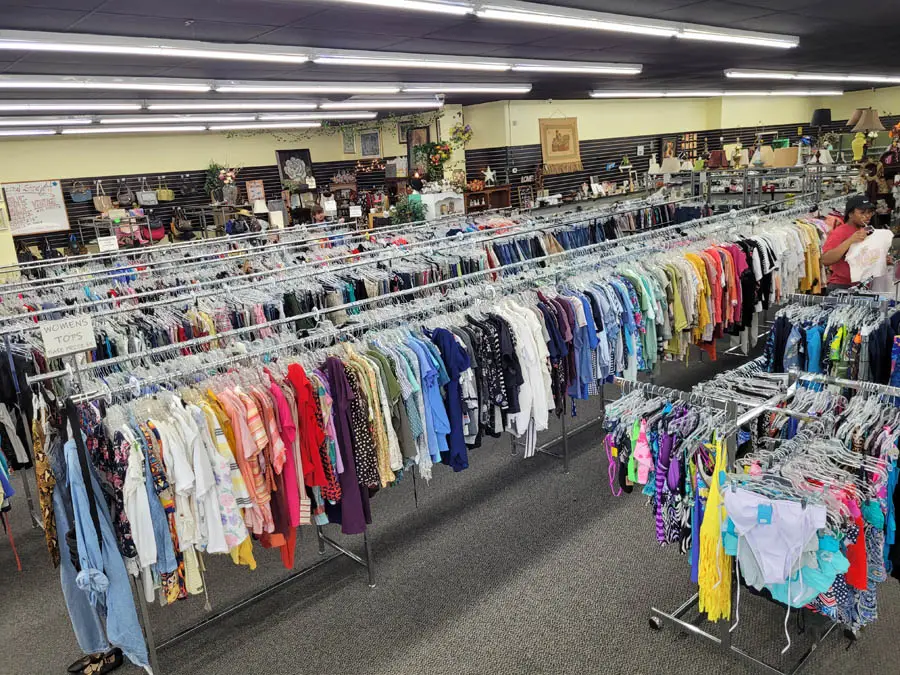 Rack of clothes in thrift store in aisle