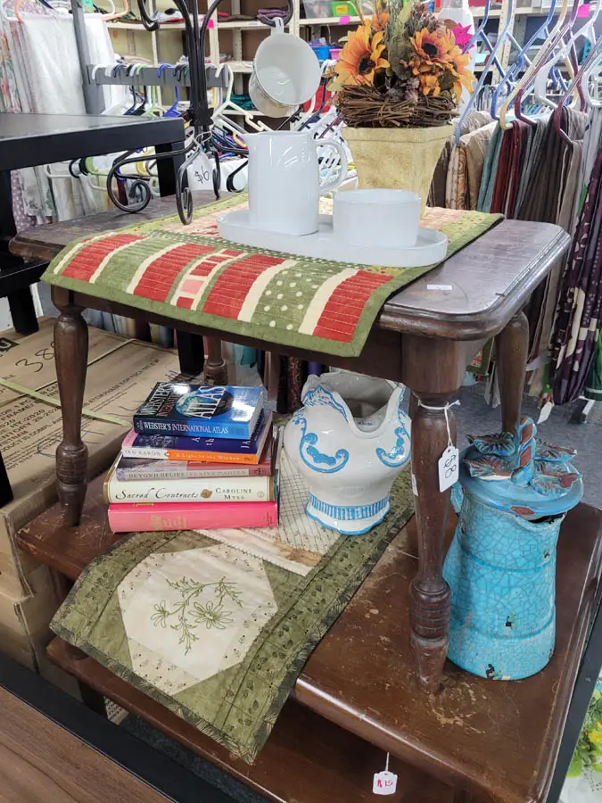 Different rugs and items on shelves