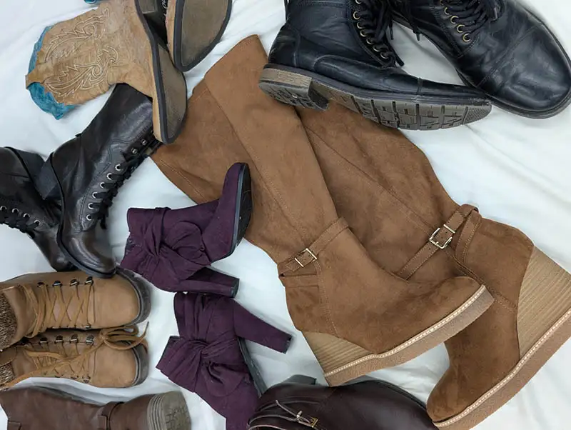 Pile of shoes on white sheet