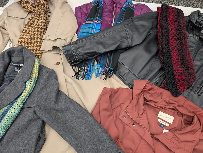 An assortment of jackets lying next to each other