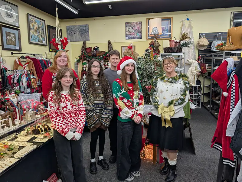 Group of employees wearing holiday clothes